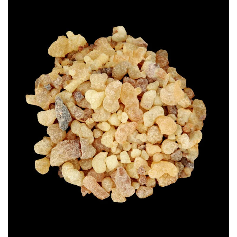 a close up of a pile of cereal on a black background