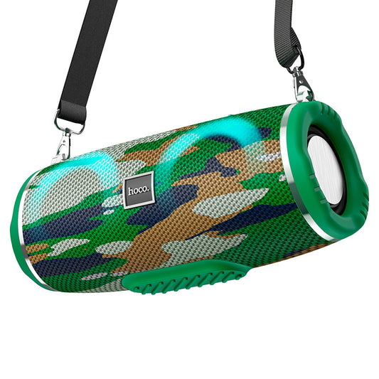 a bluetooth speaker with a green handle