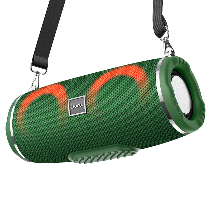 a green and red speaker with a black strap