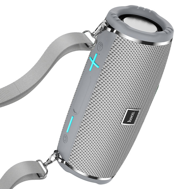 a bluetooth speaker with a lanyard attached to it