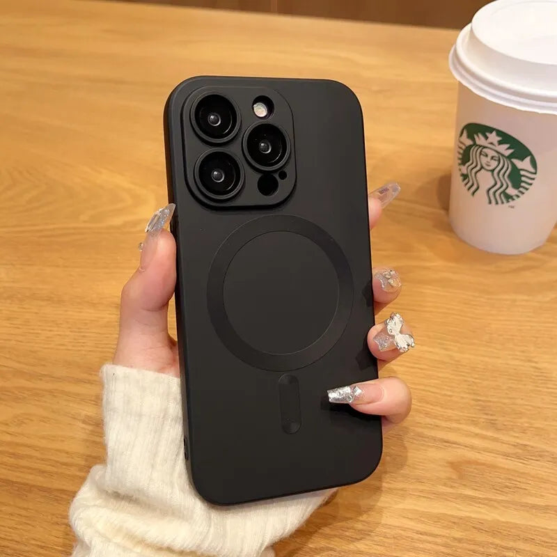 a woman's hand holding a black phone case