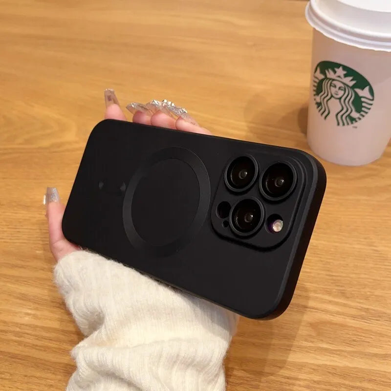 a woman's hand holding up a black phone case